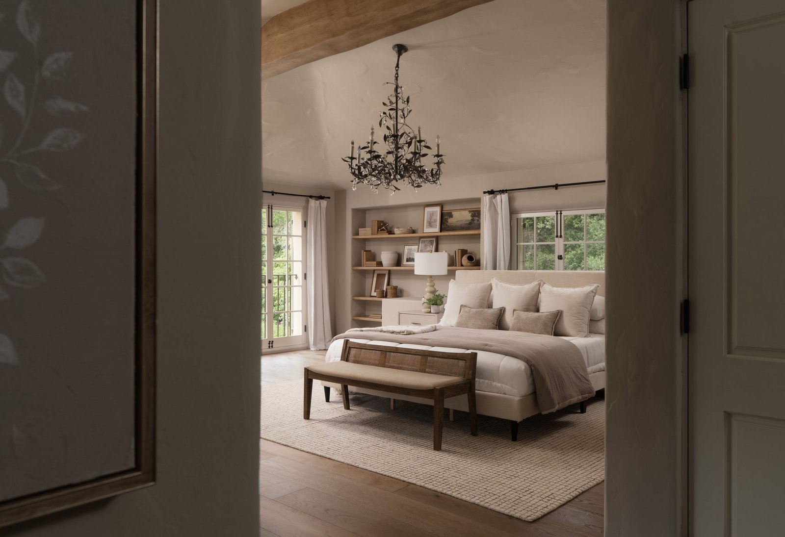 Bedroom with a chandelier and built-in shelving