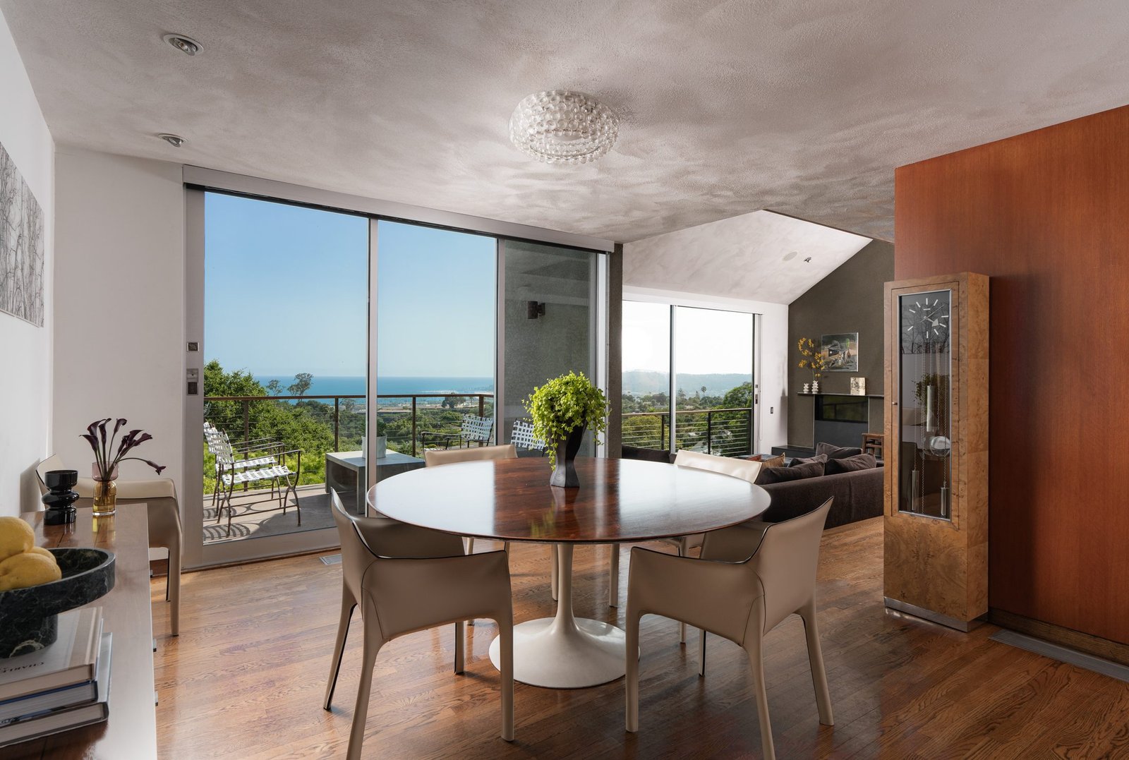 Dining room with a city view and an accent wall
