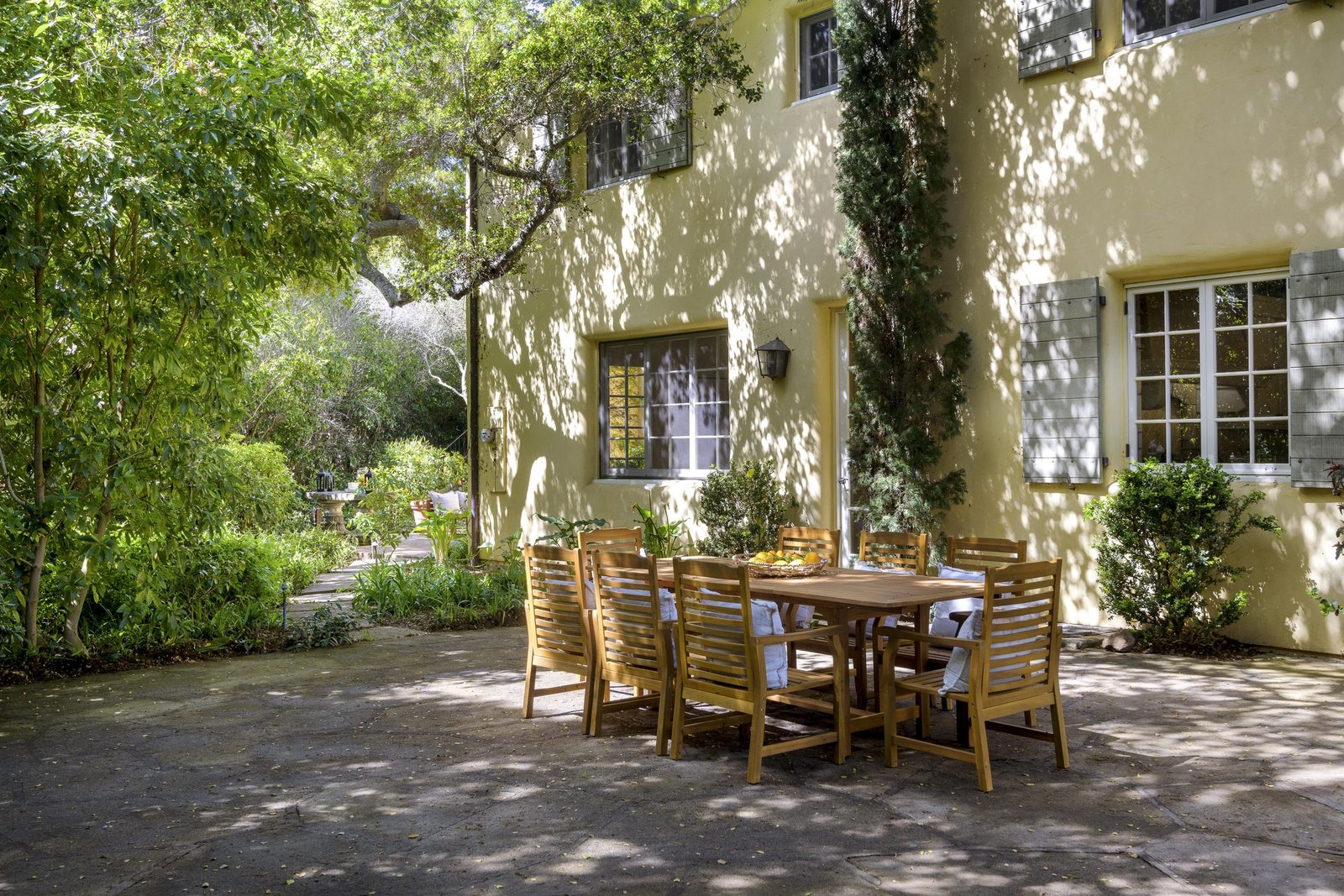Ivy-covered courtyard with an outdoor dining table