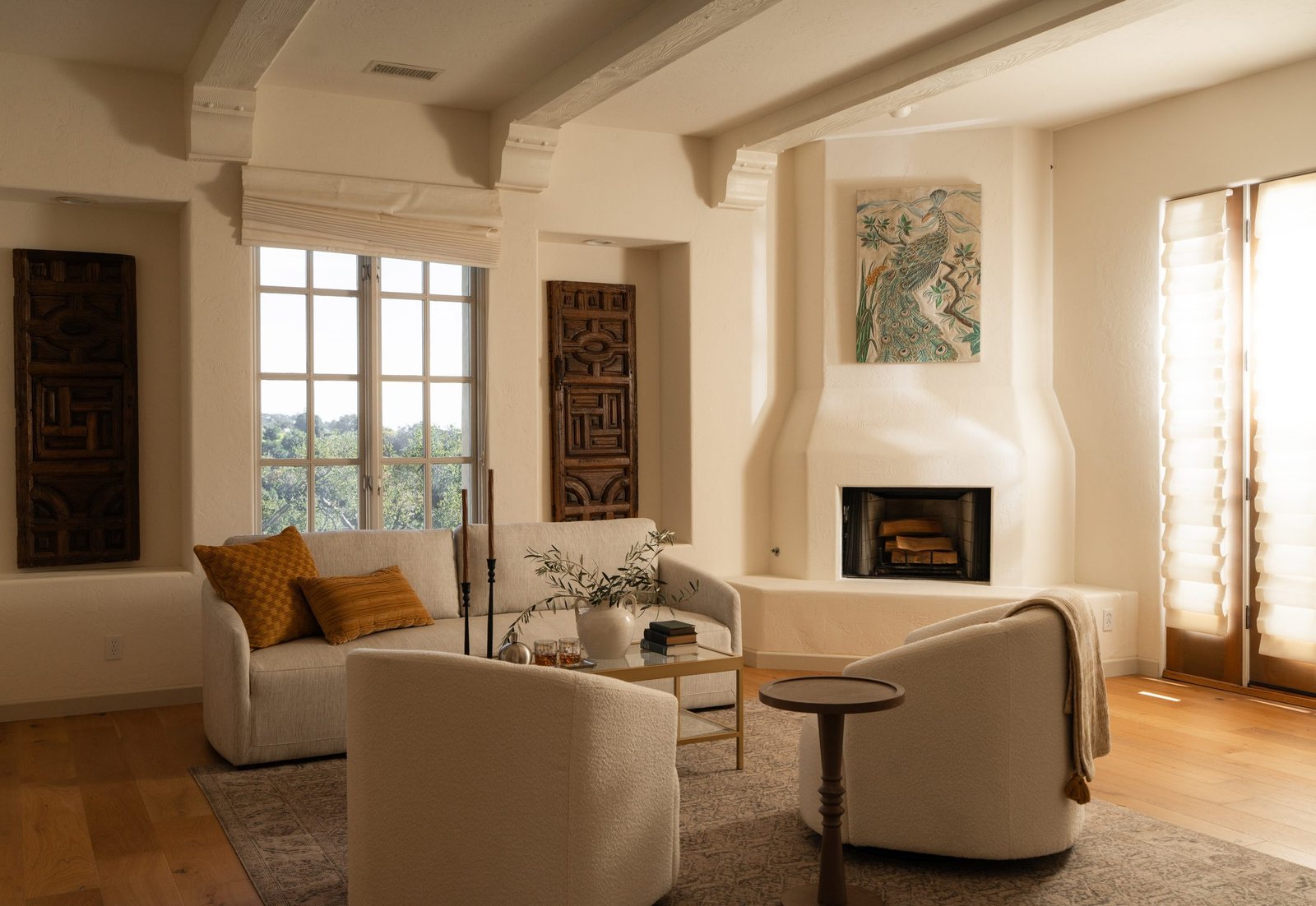Neutral living room with an arched fireplace